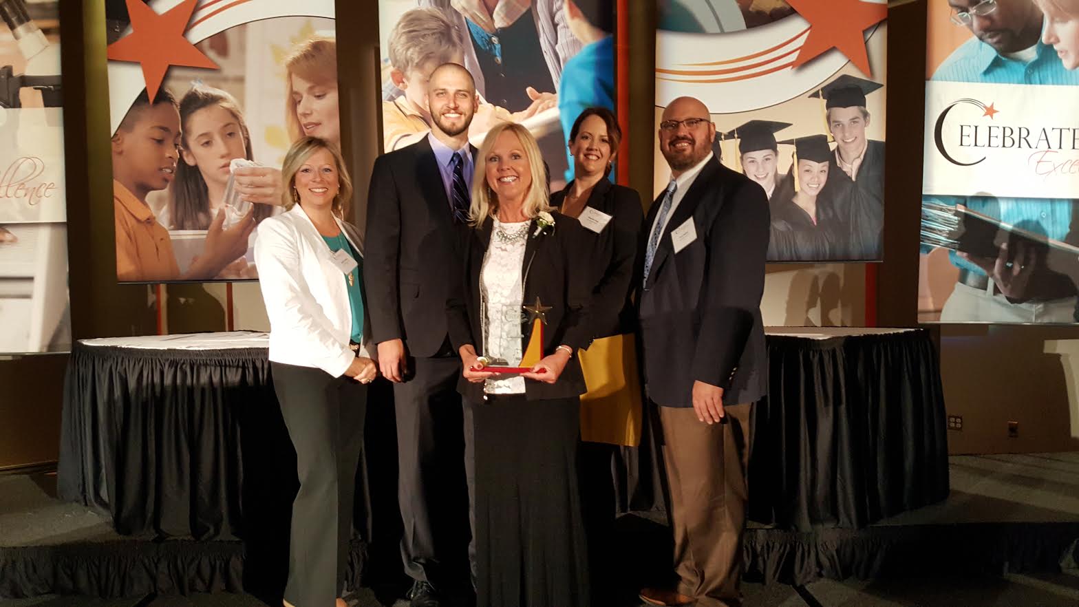 Laura Graham with administration after receiving excellence award